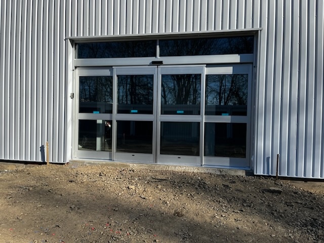 Modern commercial building with professional glass door installation by SLK Services