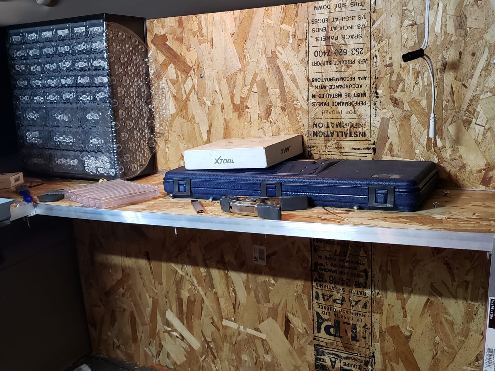 Professional locksmith workshop with specialized tools and equipment for key programming and lock services