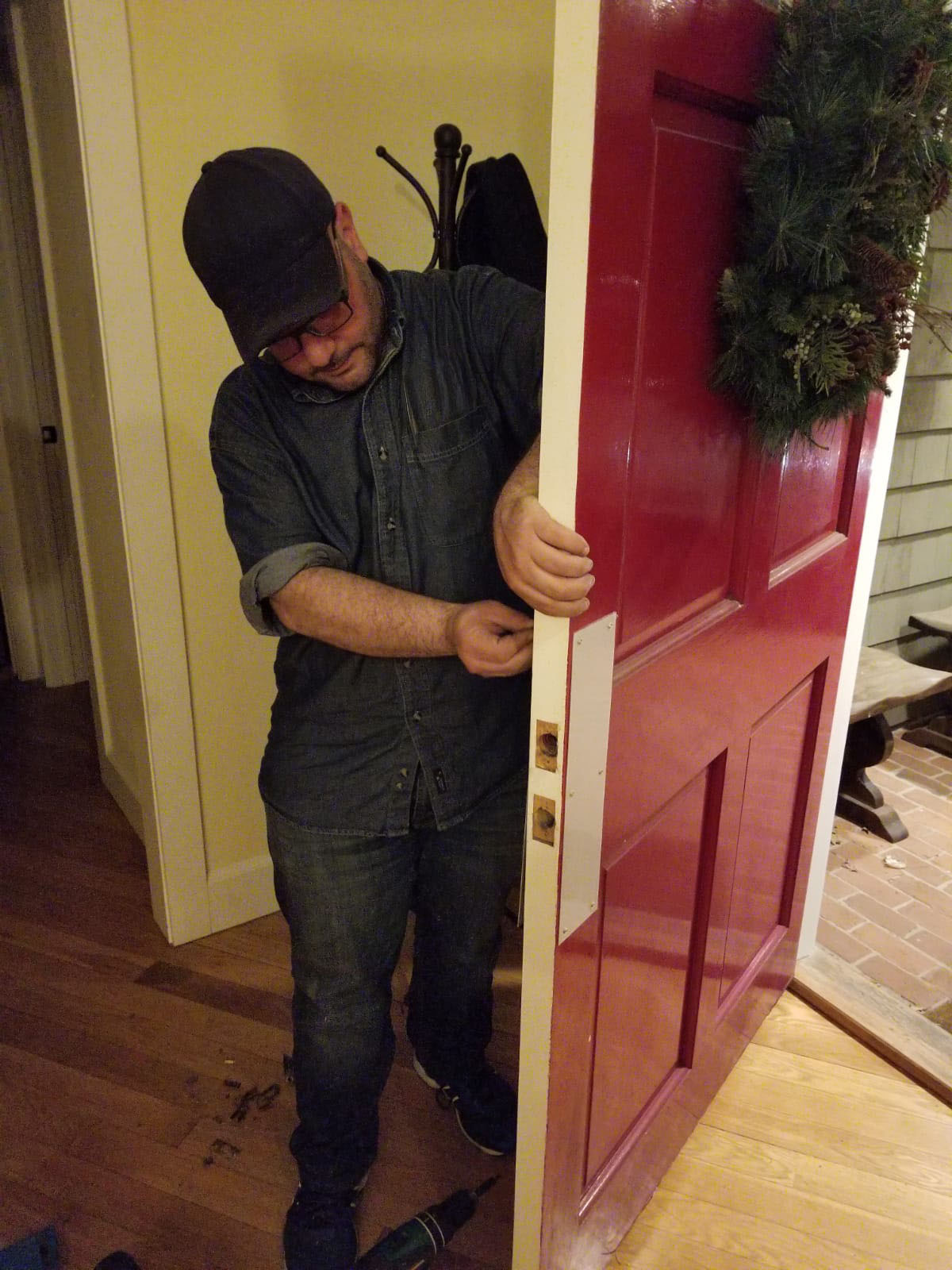 SLK Services technician working on door lock installation